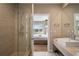 Well-appointed bathroom with a glass-enclosed shower and elegant vanity at 3056 Rockefeller Way, Kissimmee, FL 34747