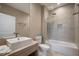 Modern bathroom featuring a sink, toilet, and bathtub with tiled walls and updated fixtures at 3056 Rockefeller Way, Kissimmee, FL 34747