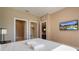 Bright bedroom with walk in closet, TV, and plush queen size bed at 3056 Rockefeller Way, Kissimmee, FL 34747