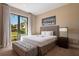 Comfortable bedroom with plush queen bed, stylish decor, and natural light at 3056 Rockefeller Way, Kissimmee, FL 34747