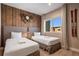 Inviting bedroom boasting two beds, a window, vintage skis wall decor and an antique style clock at 3056 Rockefeller Way, Kissimmee, FL 34747