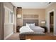 Well-lit bedroom with a king bed, stylish decor, and a view of the exterior at 3056 Rockefeller Way, Kissimmee, FL 34747