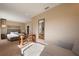 Spacious bedroom featuring a sitting area and desk adjacent to the king size bed at 3056 Rockefeller Way, Kissimmee, FL 34747