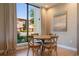 Cozy dining area with natural light, a round table, and views of the exterior at 3056 Rockefeller Way, Kissimmee, FL 34747