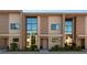 Modern townhome exterior featuring a contemporary design and large windows at 3056 Rockefeller Way, Kissimmee, FL 34747