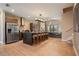 Spacious kitchen with seating at the island, stainless steel appliances, and stylish lighting at 3056 Rockefeller Way, Kissimmee, FL 34747