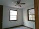 A bedroom with a ceiling fan and two windows at 31429 Anna St, Deland, FL 32720
