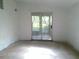 Spacious room with sliding glass doors leading to the patio at 31429 Anna St, Deland, FL 32720