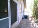 Exterior home view with bamboo background, side door with screen, central air unit, and trimmed window at 31429 Anna St, Deland, FL 32720