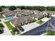 Aerial view of community featuring houses with private parking and access to a community swimming pool at 3280 Villa Way Cir, St Cloud, FL 34769