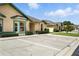 Street view of a single-story home with well-manicured landscaping and ample parking at 3280 Villa Way Cir, St Cloud, FL 34769