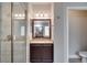 Bathroom with a glass enclosed shower, and a dark wooden vanity at 3519 Gatlin Place Cir, Orlando, FL 32812