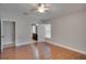 Bedroom features hardwood floors and access to a full ensuite bathroom at 3519 Gatlin Place Cir, Orlando, FL 32812