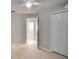 Bright bedroom features light-colored wood floors, neutral walls, a ceiling fan and closet at 3519 Gatlin Place Cir, Orlando, FL 32812