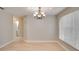 Inviting dining room featuring wood flooring and a stylish chandelier at 3519 Gatlin Place Cir, Orlando, FL 32812