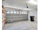 This garage features shelving, windows and a garage door at 3519 Gatlin Place Cir, Orlando, FL 32812