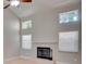 Living room featuring a fireplace, vaulted ceilings, and several windows for natural light at 3519 Gatlin Place Cir, Orlando, FL 32812