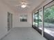 Screened patio with ceiling fan and sliding glass door at 3519 Gatlin Place Cir, Orlando, FL 32812