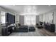 Comfortable primary bedroom with a large bed, stylish decor, and a window overlooking neighborhood at 426 Veneto Cir, Clermont, FL 34715