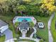 Aerial view of community pool, cabana, and surrounding trees and landscaping at 4316 Foggy Oak Ln, Sanford, FL 32773