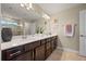Bathroom featuring double vanity with ample counter space and a large mirror at 4316 Foggy Oak Ln, Sanford, FL 32773