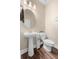 Powder bathroom featuring pedestal sink and wood flooring at 4316 Foggy Oak Ln, Sanford, FL 32773