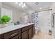 Stylish bathroom featuring a modern vanity with white countertops and a shower/tub combo at 4316 Foggy Oak Ln, Sanford, FL 32773