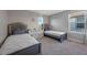 Shared bedroom with two twin beds, natural light, neutral color scheme and storage at 4316 Foggy Oak Ln, Sanford, FL 32773