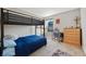 Comfortable bedroom featuring a lofted bed, desk, and dresser for a cozy space at 4316 Foggy Oak Ln, Sanford, FL 32773