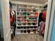 Spacious walk-in closet with custom shelving for shoes and clothing at 4316 Foggy Oak Ln, Sanford, FL 32773