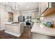 Open kitchen with white countertops, stainless steel appliances, and contemporary lighting fixtures at 4316 Foggy Oak Ln, Sanford, FL 32773