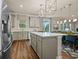 Modern kitchen with gray cabinets, stainless steel appliances, and large island with pendant lighting at 4316 Foggy Oak Ln, Sanford, FL 32773