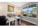 Bright office with two desks, large window with backyard view, and stylish decor at 4316 Foggy Oak Ln, Sanford, FL 32773