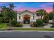 Community pool entrance showing the surrounding landscaping, nearby street, and manicured lawn at 4316 Foggy Oak Ln, Sanford, FL 32773