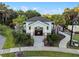 Community pool featuring a gated entrance, lush landscaping, and ample seating at 4316 Foggy Oak Ln, Sanford, FL 32773
