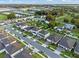 Aerial view showcasing the home, neighborhood street, landscaping, and surrounding community at 4316 Foggy Oak Ln, Sanford, FL 32773