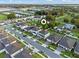 An aerial street view showcasing the home, neighborhood street, sidewalks, and surrounding greenery at 4316 Foggy Oak Ln, Sanford, FL 32773
