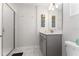 Clean bathroom featuring a modern vanity and glass enclosed shower at 4974 Windermere Ave, Kissimmee, FL 34746