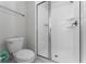 Bright bathroom featuring a glass enclosed shower and modern toilet at 4974 Windermere Ave, Kissimmee, FL 34746