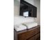 Bedroom featuring wood dresser with towels and wall mounted TV at 4974 Windermere Ave, Kissimmee, FL 34746