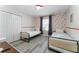 bedroom with two twin beds, and fun Mickey Mouse wallpaper at 4974 Windermere Ave, Kissimmee, FL 34746