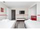 bedroom with two twin beds, TV, and an open closet at 4974 Windermere Ave, Kissimmee, FL 34746