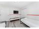 bedroom featuring two twin beds, closet, and a TV at 4974 Windermere Ave, Kissimmee, FL 34746