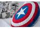Close-up on a Marvel Captain America themed pillow on a bed with white sheets at 4974 Windermere Ave, Kissimmee, FL 34746