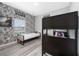 Bedroom featuring a bunk bed and twin bed with comic themed wallpaper at 4974 Windermere Ave, Kissimmee, FL 34746