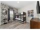 Whimsical ' bedroom featuring a bunk bed, playful wall decor, and ample space for fun and relaxation at 4974 Windermere Ave, Kissimmee, FL 34746
