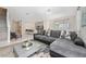 Spacious living room with open floor plan including staircase, kitchen, dining area, and cozy seating arrangement at 4974 Windermere Ave, Kissimmee, FL 34746