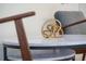 Marble side table featuring a gold sculpture with two gray armchairs in the background at 4974 Windermere Ave, Kissimmee, FL 34746