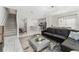 Open-concept living area featuring a modern kitchen, dining area, and comfortable seating, perfect for entertaining guests at 4974 Windermere Ave, Kissimmee, FL 34746
