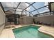 Relaxing screened-in pool with lounge chairs and patio seating at 4974 Windermere Ave, Kissimmee, FL 34746